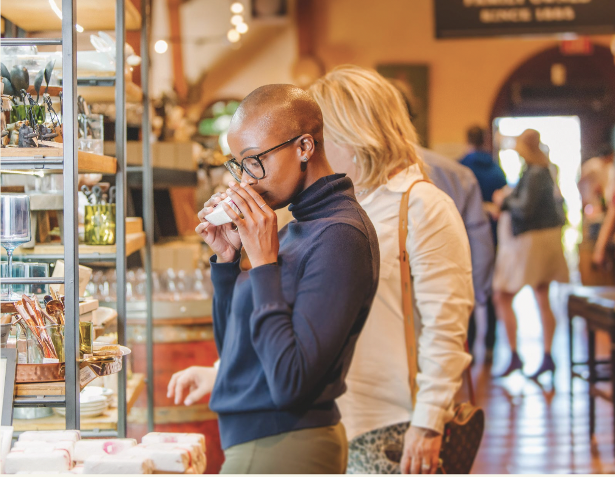Guests browsing and tasting inside the winery marketplace